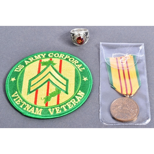 188 - An original US United States Armed Forces Vietnam War Service medal along with a US Army Corporal pa... 