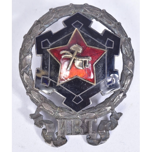 190 - An early Russian Soviet Union Red Guards Commander badge. Silver with back and red enamel and a cent... 