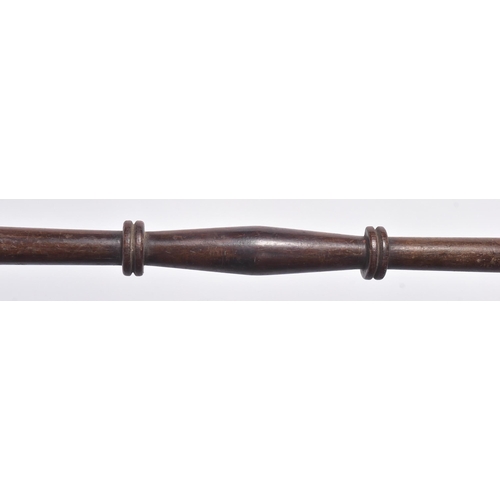 195 - An early 19th Century British Navy polearm. Turned wooden shaft with a weighted bulbous end and a sp... 