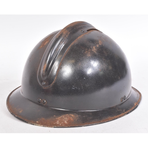 197 - A WWII Second World War French Milice helmet. The black Adrian pattern helmet with a metal ' Gamma '... 