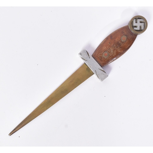 203 - A WWII Second World War Third Reich Nazi German trench art style knife. The pommel with a brass case... 