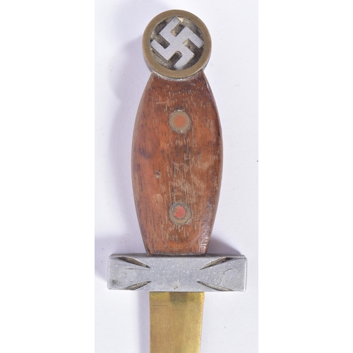 203 - A WWII Second World War Third Reich Nazi German trench art style knife. The pommel with a brass case... 