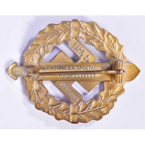 205 - A WWII Second World War Third Reich Nazi German SA Sports Badge. A gold grade example depicting a Ro... 