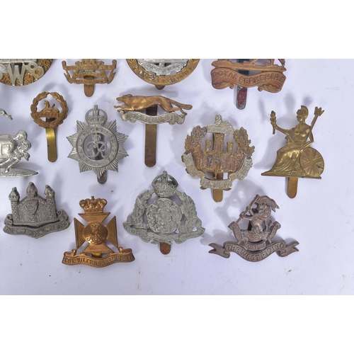 206 - A collection of pre and post WWII Second World War British Army cap badges to include; Royal Berkshi... 