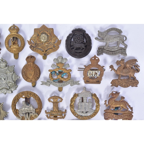 206 - A collection of pre and post WWII Second World War British Army cap badges to include; Royal Berkshi... 