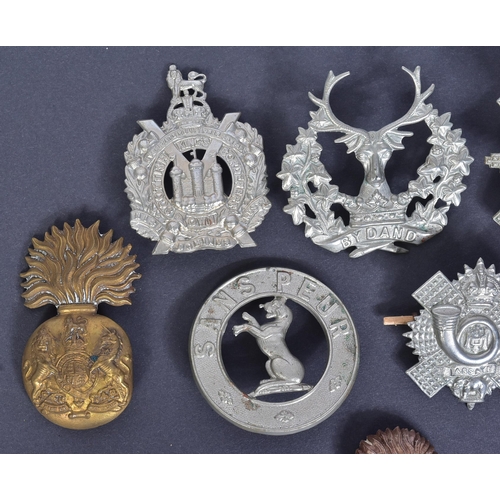 212 - A collection of Scottish interest military uniform cap badges to include; Royal Scots Fusiliers, 5th... 