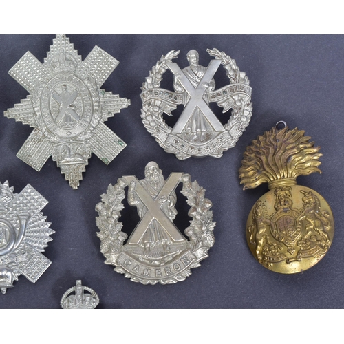 212 - A collection of Scottish interest military uniform cap badges to include; Royal Scots Fusiliers, 5th... 