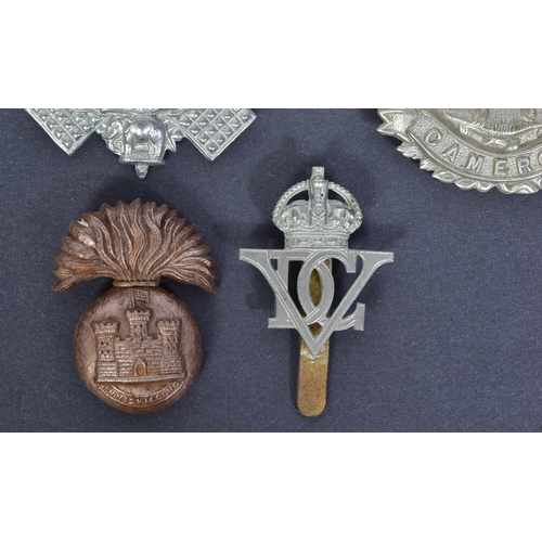 212 - A collection of Scottish interest military uniform cap badges to include; Royal Scots Fusiliers, 5th... 