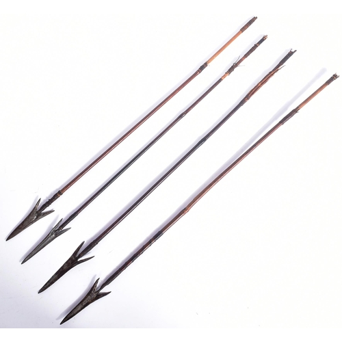 213 - A collection of x4 African tribal / hunting arrows with forged iron tips and bamboo shafts. Each mea... 