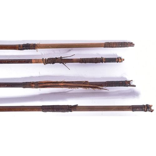 213 - A collection of x4 African tribal / hunting arrows with forged iron tips and bamboo shafts. Each mea... 