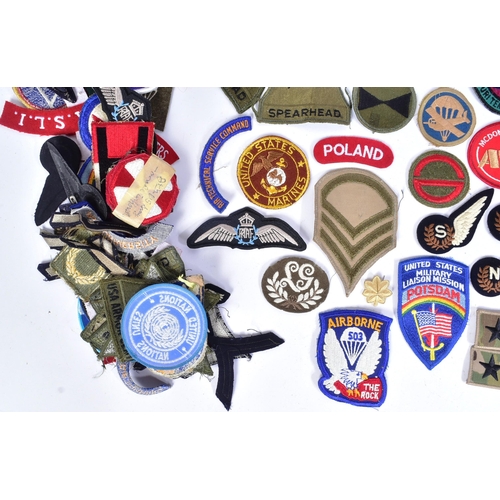 218 - A large collection of assorted Military badges / patches to include RAF Wings (Engineer, Bomb Air Cr... 