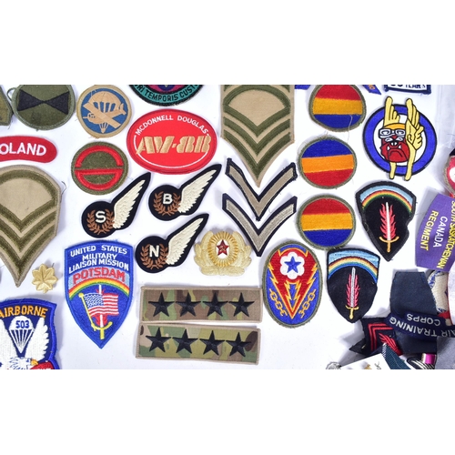 218 - A large collection of assorted Military badges / patches to include RAF Wings (Engineer, Bomb Air Cr... 