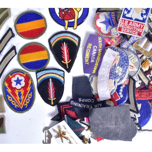 218 - A large collection of assorted Military badges / patches to include RAF Wings (Engineer, Bomb Air Cr... 