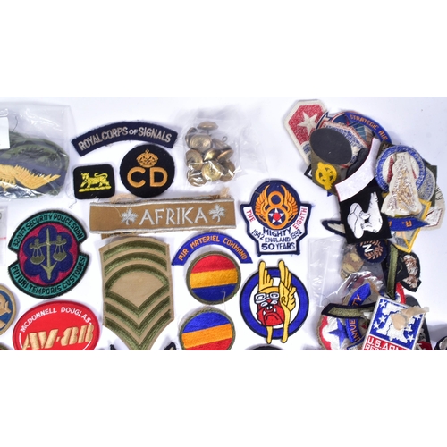 218 - A large collection of assorted Military badges / patches to include RAF Wings (Engineer, Bomb Air Cr... 