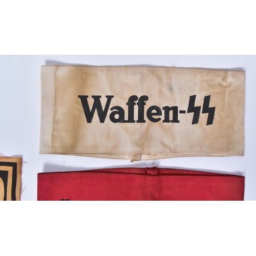 219 - A collection of WWII Second World War style Third Reich Nazi German Waffen SS armbands along with a ... 