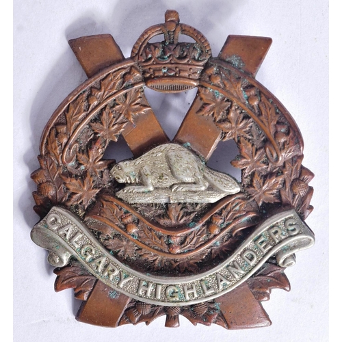 227 - Two Canadian military uniform cap badges comprising the Calgary Highlanders and Glengarry Fencibles.