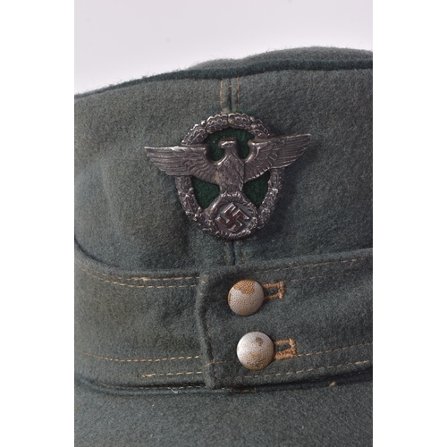 228 - A WWII Second World War Third Reich Nazi German Field Police M42 cap. Green wool with a front Police... 