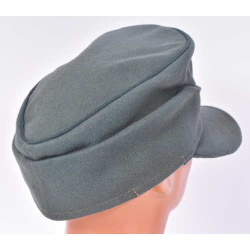 228 - A WWII Second World War Third Reich Nazi German Field Police M42 cap. Green wool with a front Police... 