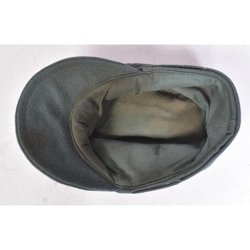 228 - A WWII Second World War Third Reich Nazi German Field Police M42 cap. Green wool with a front Police... 