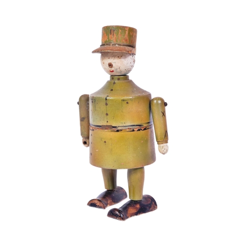 231 - A believed WWI First World War era wooden figure of a French soldier wearing a Kepi hat. Two piece w... 