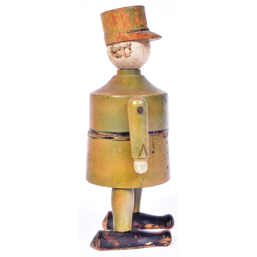 231 - A believed WWI First World War era wooden figure of a French soldier wearing a Kepi hat. Two piece w... 