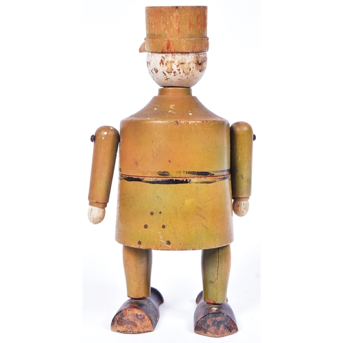 231 - A believed WWI First World War era wooden figure of a French soldier wearing a Kepi hat. Two piece w... 