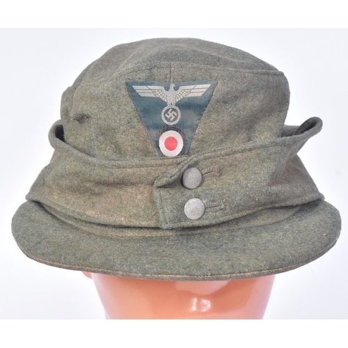 246 - A WWII Second World War Third Reich Nazi German M43 cap with Light Infantry Mountain Troops insignia... 