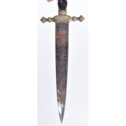 259 - A 19th Century Spanish dagger with Toledo blade. Dome shaped brass pommel with scrolling motifs, bla... 