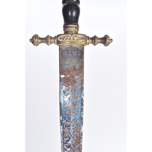 259 - A 19th Century Spanish dagger with Toledo blade. Dome shaped brass pommel with scrolling motifs, bla... 