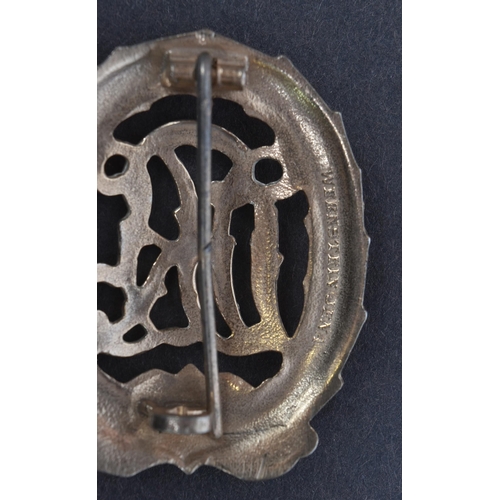 278 - A WWII Second World War Third Reich Nazi German DRL Sports badge. The badge depicting a the initials... 