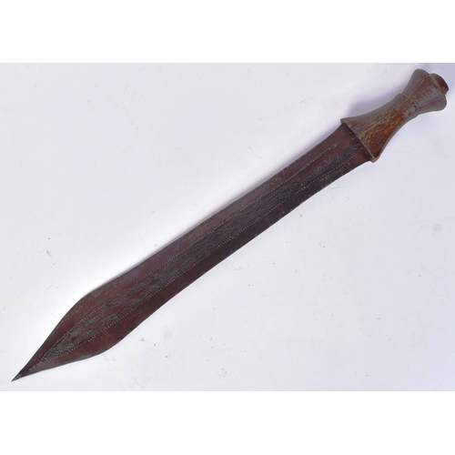 286 - An early 20th Century Central African / Congolese tribal sword. Carved wooden grip with a long doubl... 