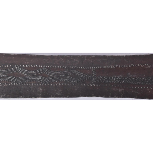 286 - An early 20th Century Central African / Congolese tribal sword. Carved wooden grip with a long doubl... 