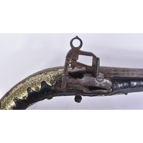 287 - A 19th Century Ottoman Empire flintlock / miquelet lock pistol / kubur. Silver gilt covered stock et... 