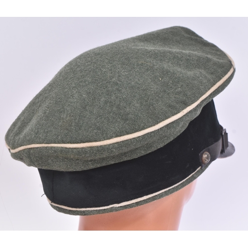 290 - A WWII Second World War Third Reich Nazi German Waffen SS NCO's visor cap. Khaki fabric with white p... 