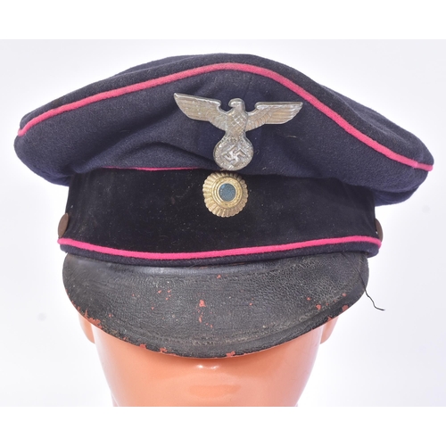 305 - A WWII Second World War Third Reich Nazi German Fireman's visor cap. Dark blue wool construction wit... 