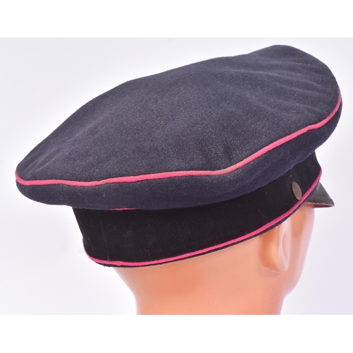 305 - A WWII Second World War Third Reich Nazi German Fireman's visor cap. Dark blue wool construction wit... 