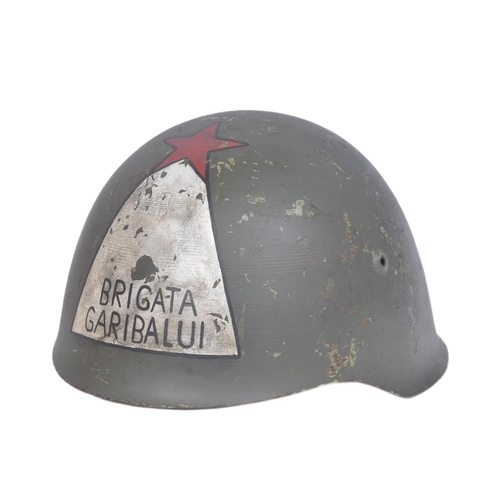 308 - A WWII Second World War Italian ' Brigata Garibaldi ' fascist helmet. The M33 helmet painted to the ... 