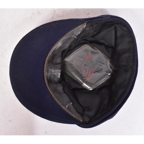 324 - A WWII Second World War Third Reich Nazi German Fireman's service cap. Blue with fuchsia piping and ... 