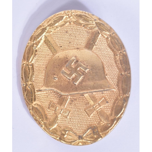 348 - A WWII Second World War Third Reich Nazi German Wound Badge. A gold class example depicting the Impe... 