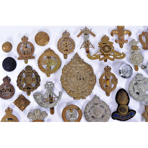 356 - A large collection of assorted British War time and post war military cap badges to include; Duke of... 