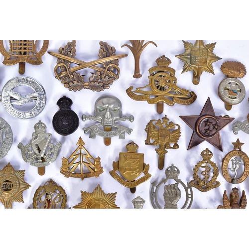 356 - A large collection of assorted British War time and post war military cap badges to include; Duke of... 