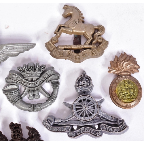 357 - A collection of British War time economy cap badges to include; Royal Artillery, East Lancashire, Pa... 