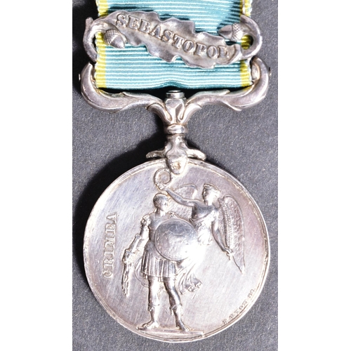 37 - Crimean War - a 19th Century Victorian British Crimean War medal with Sevastopol clasp. Impressed to... 