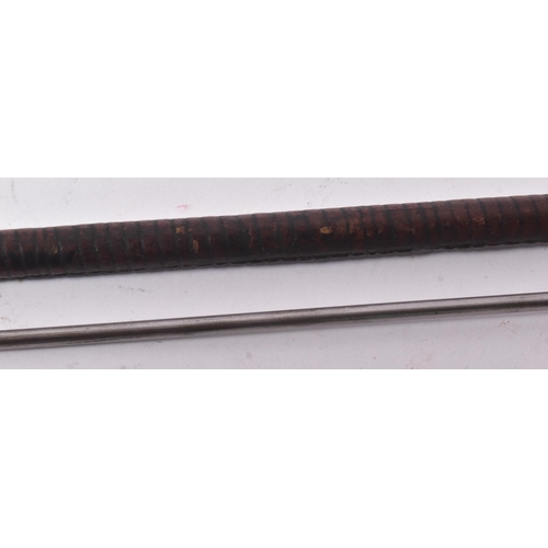 39 - A 19th Century Eastern riding crop with concealed blade. Dark tan leather plaited over the pommel an... 