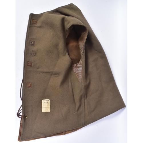 75 - A WWII Second World War British Army brown leather jerkin. The single-breasted, four-buttoned, sleev... 