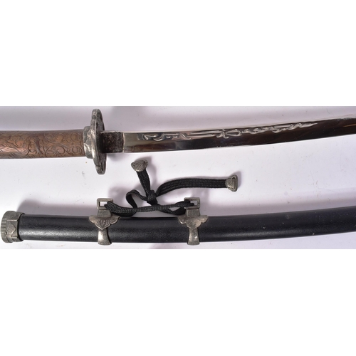 82 - A vintage Japanese Samurai Katana sword and a smaller matching Wakizashi. Each sword having a carved... 