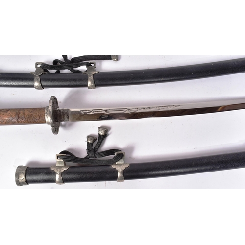82 - A vintage Japanese Samurai Katana sword and a smaller matching Wakizashi. Each sword having a carved... 