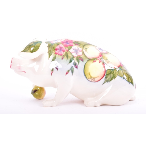 1 - Moorcroft Pottery - a vintage 1990s ceramic Peter the Pig figurine. The pig designed by Roger Mitche... 