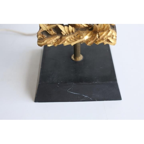 103 - A vintage 20th century 1960s gilt and ebonised wood table lamp light. The lamp having a new black sh... 