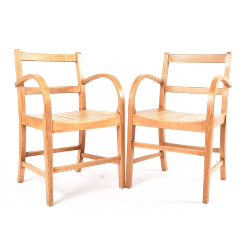 112 - A set of four RAF Air Ministry mid 20th century circa 1960s oak carver chairs. Each chair having lad... 